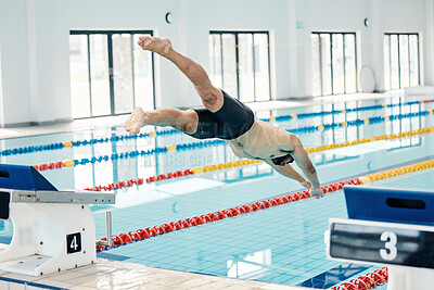 Buy stock photo Sports, swimming pool and man diving in water for training, exercise and workout for competition. Fitness, wellness and professional male athlete in action for dive, jump and race from diving board