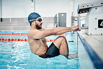 Sports, swimming pool and man start race in water for training, exercise and workout for competition. Fitness, motivation and professional male athlete with hands on diving board for back stroke