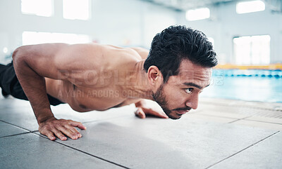 Buy stock photo Fitness, push up or man by a swimming pool training, workout or exercising for body goals with focus. Wellness, exercise or healthy young sports athlete with strong arms, endurance or motivation 