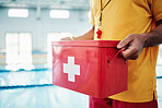 Box, safety or hands of a lifeguard by a swimming pool helping rescue the public from water danger or drowning. Zoom, trust or man with a medical kit ready for emergency injury support in an accident