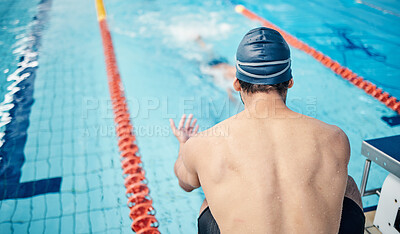 Start, back and man at swimming training for fitness, health and sports body for a competition. Workout, motivation and man ready to swim in a professional water race, games or cardio in a pool