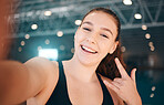 Selfie, rock and portrait of a girl at a gym for fitness, running and health with a sign for a workout. Happy, sports and face of a girl with a photo, hand emoji and smile for exercise and sport