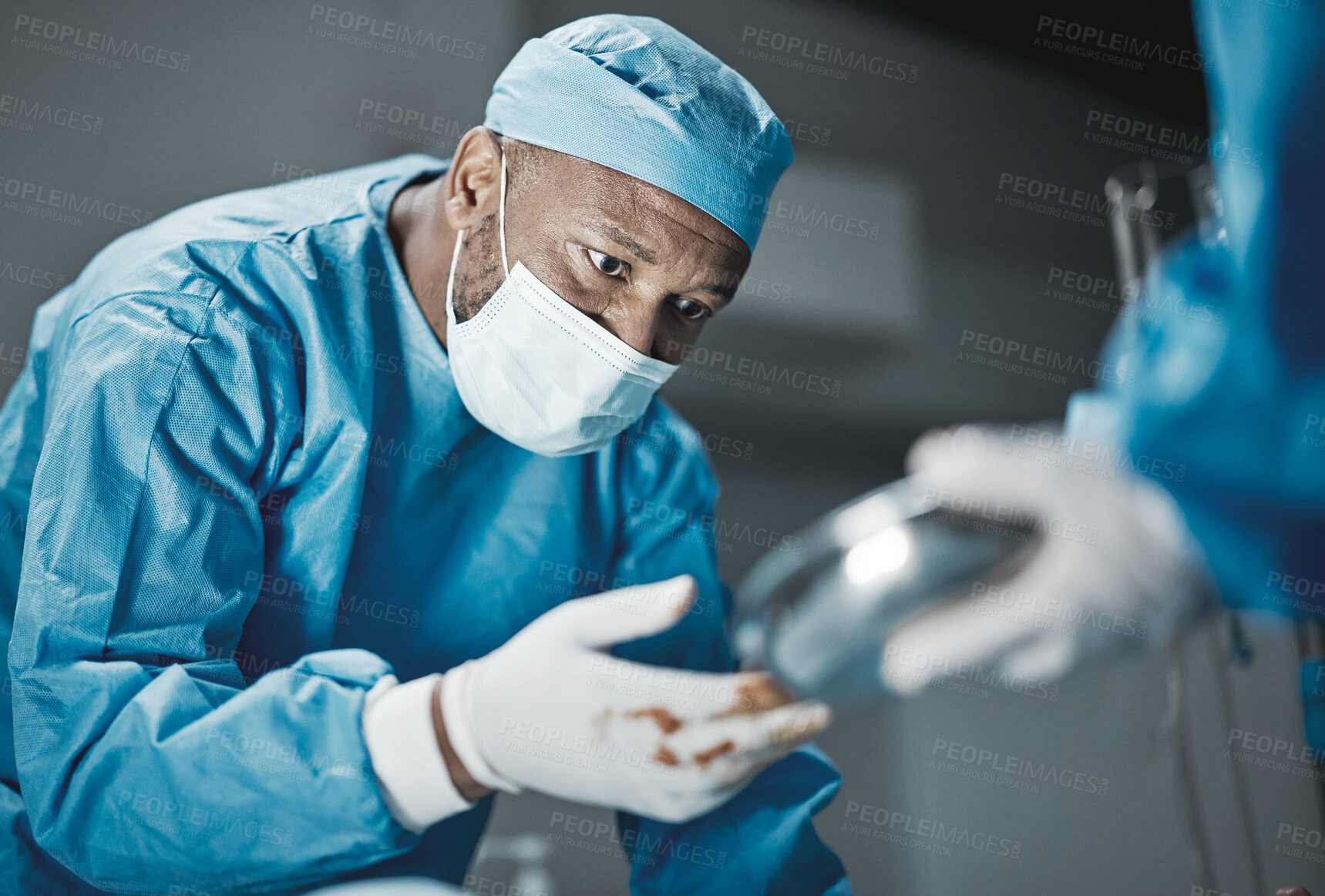 Buy stock photo Doctor, surgery and hospital theater with patient and black man surgeon for emergency, teamwork and trust. Professional medical worker in ppe for life saving tools, healthcare and health insurance