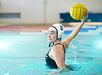 Water polo, sports and woman throwing a ball for a competition, game and training. Fitness, strong and athlete girl with focus during a professional match with action and power in a swimming pool