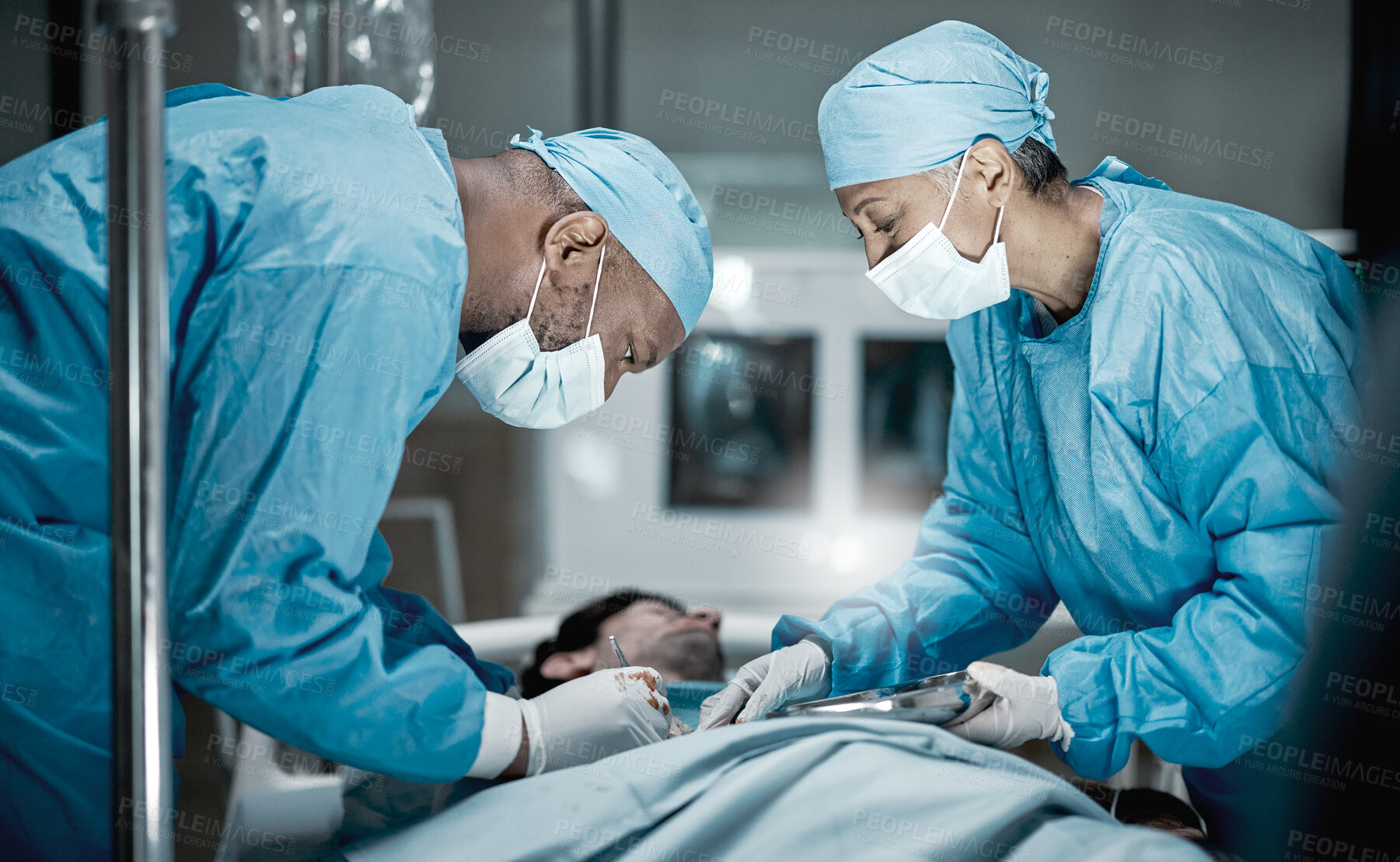 Buy stock photo Healthcare, surgery and doctors in hospital operating room for emergency operation on patient. Health clinic, collaboration or team of medical surgeons working with surgical tools to save life of man