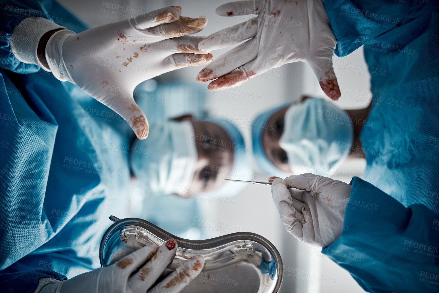 Buy stock photo Doctors, surgery and blood hands in hospital theater with surgeon team for emergency, teamwork and trust. Medical man and woman with glove for life saving, healthcare and health insurance emergency