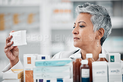 Pharmacy, stock and senior woman pharmacist with box, pills and medication, reading and checking information. Elderly lady, drugstore and health expert doing inventory check on treatment or product