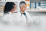 Service, pharmacy and black woman with pharmacist for advice, help and treatment or medicine choice. Customer, senior woman and discussion for pharmaceutical information, questions or drugstore pills