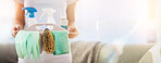 Hands, cleaning and mockup with a woman housekeeper holding a basket of detergent or disinfectant in a home. Housekeeping, hygiene and mock up with a female cleaner carrying a plastic container