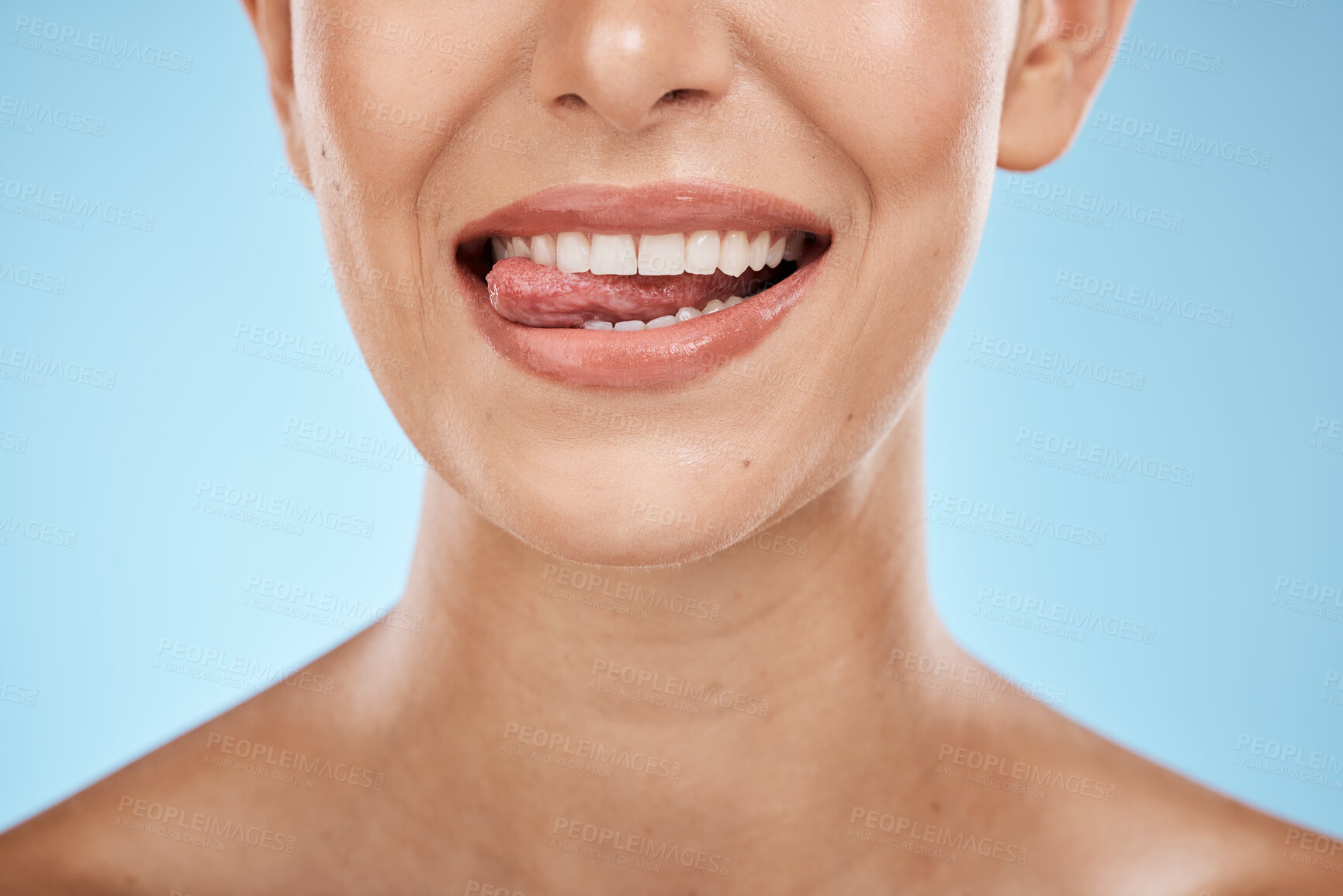 Buy stock photo Dental, health and woman with a smile in a studio for hygiene, wellness and natural oral routine. Healthy, veneers and closeup of female model with clean, beautiful and white teeth by blue background