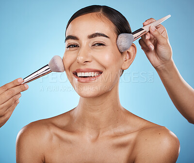 Buy stock photo Face portrait, hands and makeup brush of woman in studio isolated on blue background. Aesthetics, facial cosmetics or skincare of happy female model with brushes for foundation, powder or dermatology