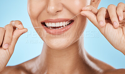 Buy stock photo Woman floss teeth zoom, smile and dental healthcare, fresh breath and mouth cleaning isolated on blue background. Face, hands and happy with oral hygiene product, healthy gums and flossing in studio