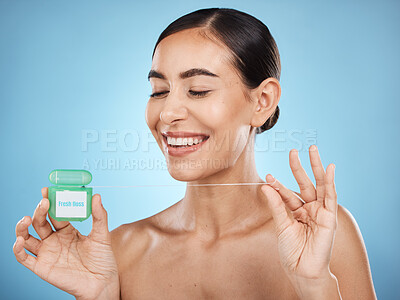 Buy stock photo Woman, floss and smile, face with dental healthcare, fresh breath and teeth cleaning isolated on blue background. Happy flossing, oral hygiene product and mouth health with healthy gums in studio