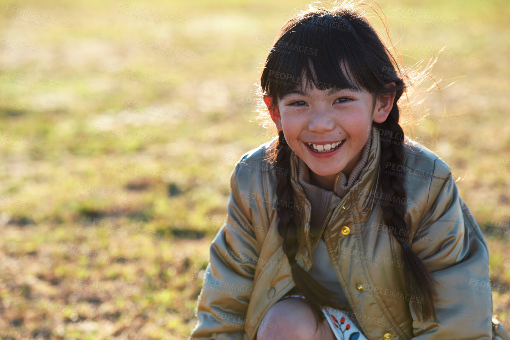 Buy stock photo Portrait, Asian girl and playing in park, smile and carefree on holiday, summer and freedom. Young person, female child and kid with happiness, play game or on field for fun, relax and break on grass