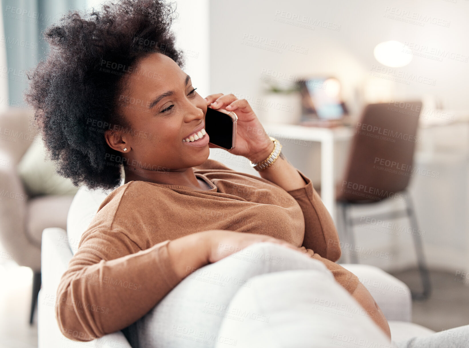 Buy stock photo Phone call, relax and smile with a black woman in the living room of her home, sitting on a sofa while talking. Mobile, communication and conversation with a young female chatting in her house