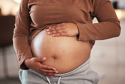 Buy stock photo Hands, stomach and pregnant black woman in home for maternity leave, health and wellness. Pregnancy, prenatal motherhood and female, mama or future mother touching belly with hope for newborn baby.