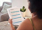 Paperwork, health insurance and woman reading in her house for healthcare hospital treatment. Planning, home and African female analyzing a medical document in the living room of her apartment.