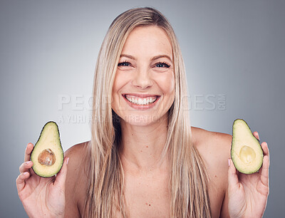 Buy stock photo Beauty, skin or hair care avocado for woman portrait in studio with natural cosmetic and shampoo shine. Face of aesthetic model with fruit on grey background for hairdresser or sustainable product