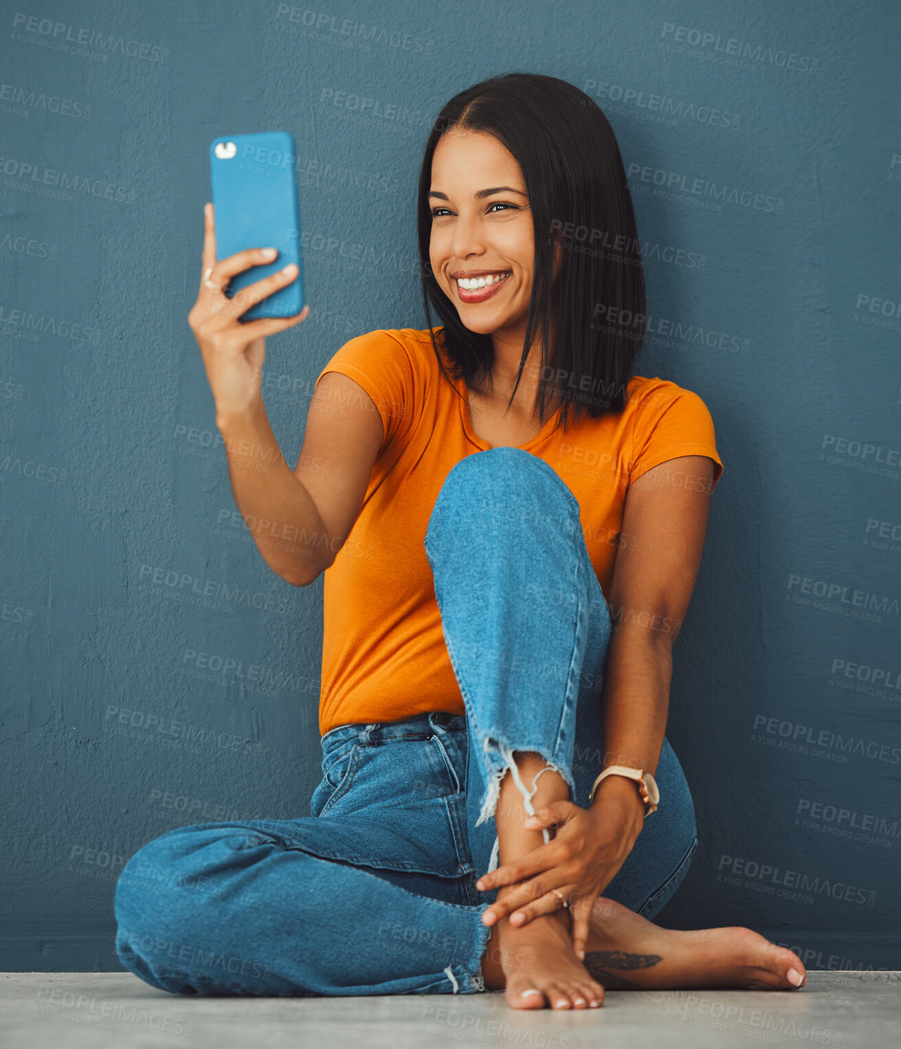 Buy stock photo Black woman, floor and home with smile for selfie fashion clothes or relax with beauty by wall background. Gen z girl, smartphone and happy in house with feet, jeans or face photo for profile picture