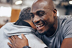 Black man, friends and hug in fitness for exercise, workout or training class together at the gym. Happy African American male hugging friend in celebration for healthy wellness or cardio achievement