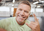 Selfie, fitness and portrait of man in gym with rock hand sign for muscle, wellness and cardio workout. Smile, healthy body and face of senior male for bodybuilder training, exercise and sports goals