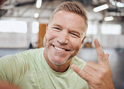 Buy stock photo Selfie, fitness and portrait of man in gym with rock hand sign for muscle, wellness and cardio workout. Smile, healthy body and face of senior male for bodybuilder training, exercise and sports goals