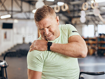 Buy stock photo Shoulder pain, training and bodybuilder man at gym for fitness, workout or challenge exercise in medical risk. Injury, muscle and strong person or athlete in sports burnout, arm accident or arthritis