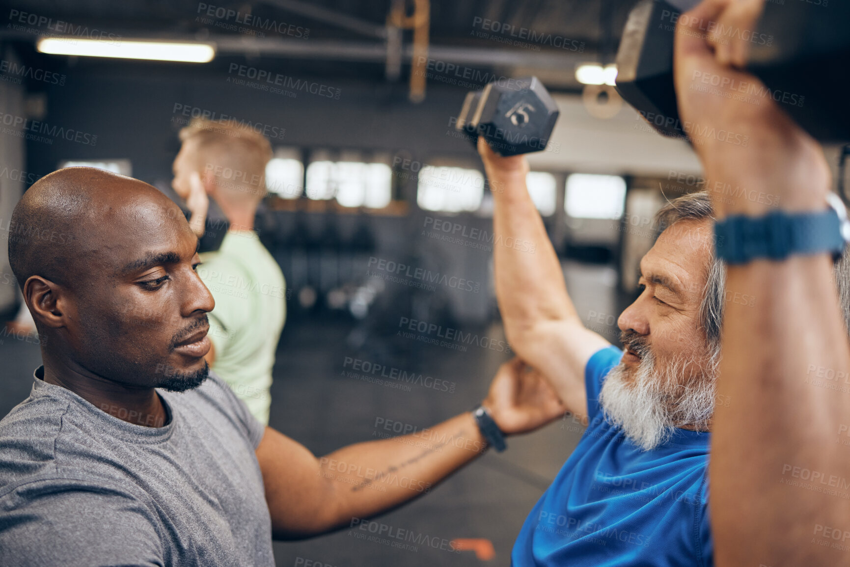 Buy stock photo Fitness, old man and personal trainer coaching with dumbbell weightlifting, muscle support and gym in retirement. Health, exercise and workout at senior training club, sports coach helping grandpa.