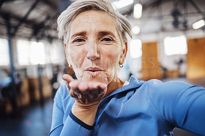 Buy stock photo Senior woman, blowing kiss and fitness selfie at gym while happy after exercise, training or workout. Portrait of old person with smile for health, wellness and motivation for healthy lifestyle goals