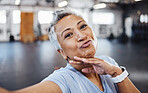 Selfie, pout and wellness senior woman taking picture in the gym after exercise, workout or training. Elderly, old and portrait of a fit female happy for health and fitness on social media