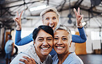 Business women, senior portrait and happiness of company friends in a warehouse with peace sign. Smile, teamwork hug and mature female group of happy entrepreneur staff ready for working together 