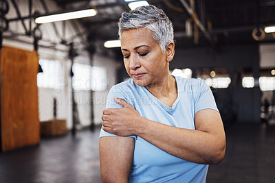 Buy stock photo Shoulder pain, fitness and senior woman at gym in training, workout or lose weight exercise with health risk. Injury, muscle and elderly person or athlete in sports burnout, arm accident or arthritis