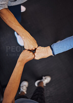 Buy stock photo Teamwork, top view and senior women fist bump for team building, motivation and unity. Support, collaboration and group of elderly friends huddle for trust, union or solidarity, goals or targets.