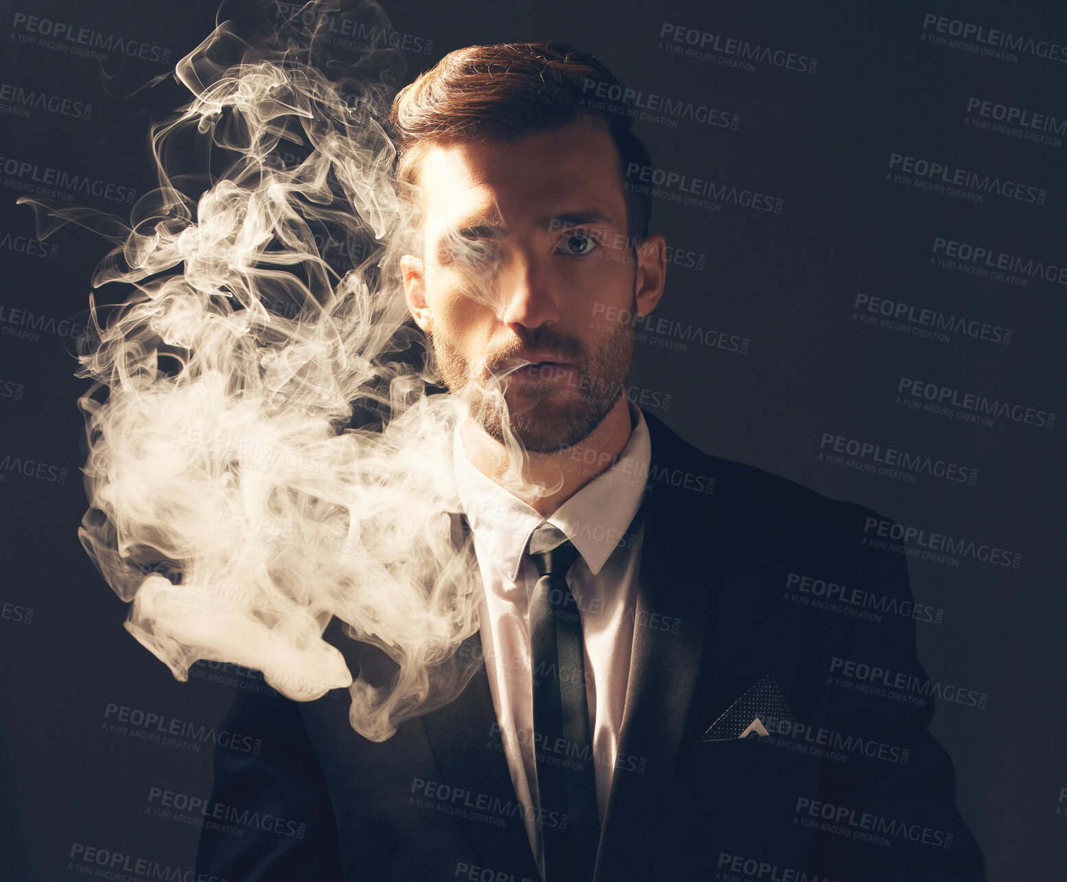 Buy stock photo Executive, portrait and man with smoke in a suit for fashion isolated on a dark background in studio. Sexy, vintage and businessman looking stylish, professional and rich while smoking on a backdrop