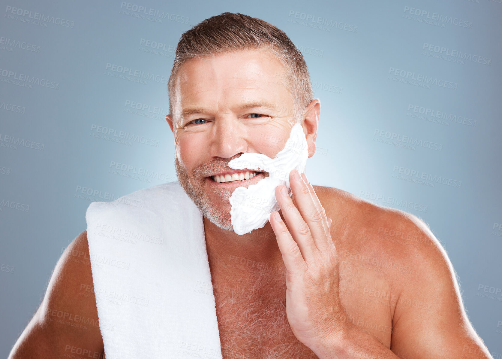 Buy stock photo Shaving beard, smile and man portrait with cream and razor for face cleaning, wellness and skincare. Morning grooming, foam and model with facial care and skin treatment to shave hair in a studio