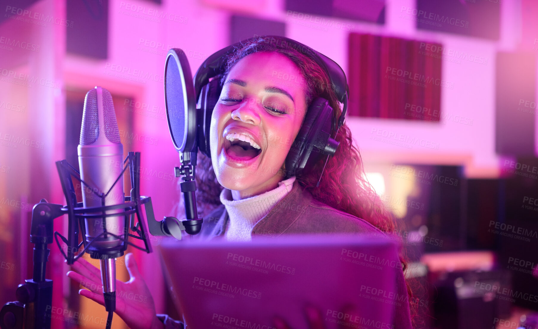 Buy stock photo Technology, singing or musician on neon microphone, music studio lyrics or songwriting app in night recording. Singer, woman or artist on tablet in production, voice media or sound light performance