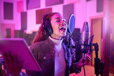 Buy stock photo Technology, singing or woman on neon microphone, music studio lyrics or songwriting app in night recording. Singer, musician or artist on tablet in production, voice media or sound light performance