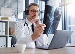 Doctor, x ray and man with headset and laptop in hospital for healthcare and wellness. Thinking, radiology and mature medical professional looking at mammogram picture, scan or bone xray in clinic.