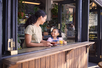 Buy stock photo Coffee shop, black family and children with a mother and daughter enjoying a beverage in a cafe together. Juice, caffeine and kids with a woman and happy female child bonding in a restaurant