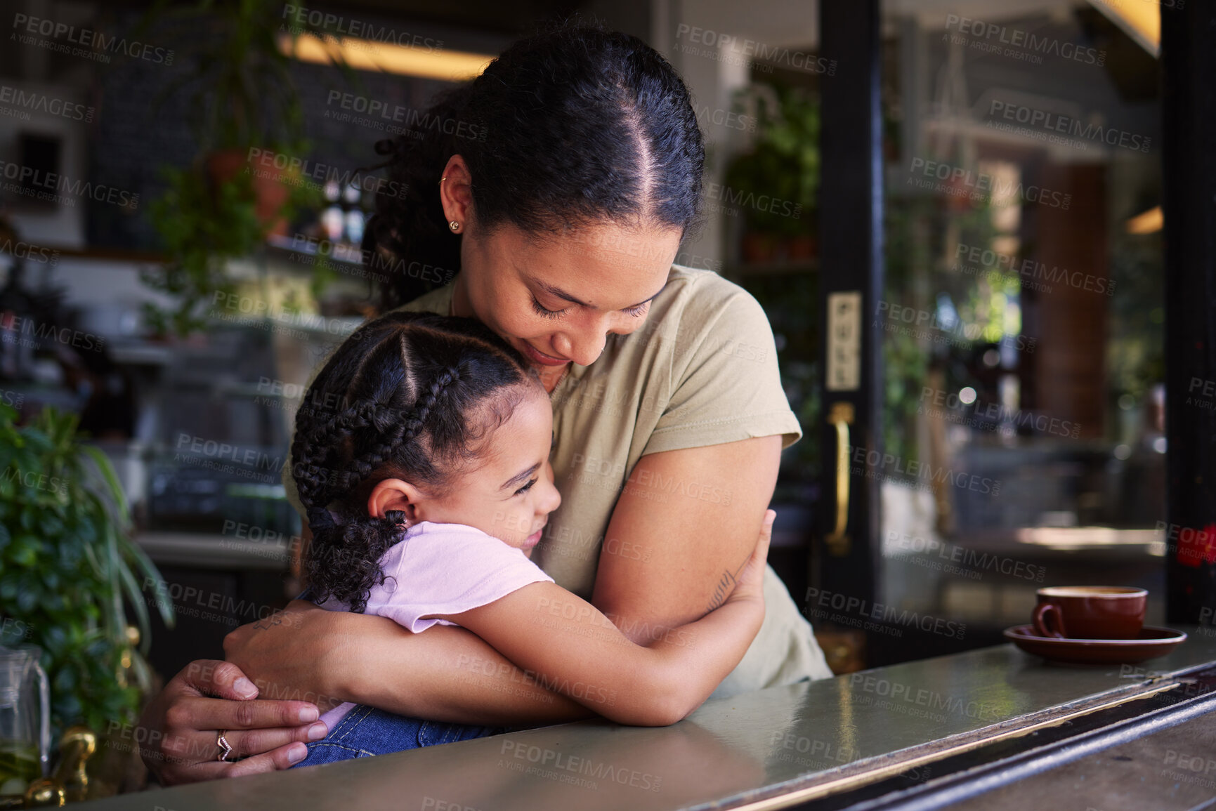 Buy stock photo Cafe, mom and child hug in restaurant for love, care and quality time together. Happy mother hugging girl kids in coffee shop at table for happiness, smile and embrace for bonding, relaxing and fun