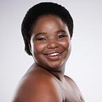 Black woman, portrait and face in skincare beauty with teeth, cosmetics or makeup against a gray studio background. Happy African American female smile in satisfaction for self love, care or facial
