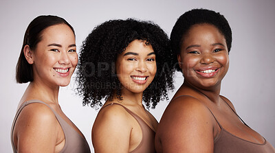 Buy stock photo Women, diversity studio portrait and smile for aesthetic, beauty or race equality with plus size solidarity. Model, asian and black woman with cosmetic, makeup and wellness with support for inclusion