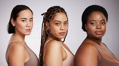 Buy stock photo Women, diversity and studio portrait with support for trust, underwear or skincare for beauty aesthetic. Model, asian and black woman with inclusion, makeup or wellness with skin health by background