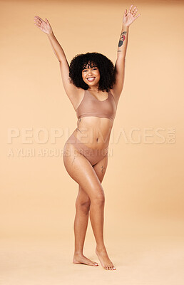Buy stock photo Body positivity, happy and portrait of a woman in underwear isolated on a beige studio background. Cheerful, smile and lingerie model with freedom, happiness and sexy in bikini fashion on a backdrop 