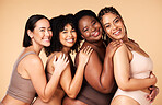 Skin care, portrait and diversity women group together for inclusion, natural beauty and power. Happy aesthetic model friends on beige background for support, makeup glow and underwear body self love