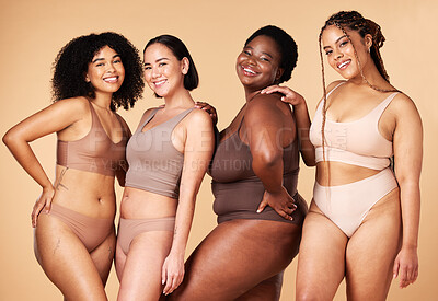 Buy stock photo Diversity, happy woman and body portrait of group together for inclusion, skin beauty and power. Underwear model friends on beige background for positivity, pride and motivation support for self love