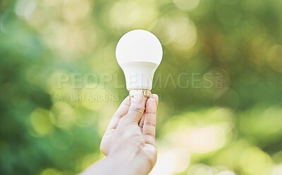 Buy stock photo Outdoor, renewable energy and hand with light bulb, green and power development for positive impact. Holding bulb, eco friendly and nature with carbon footprint, ideas for change and sustainability