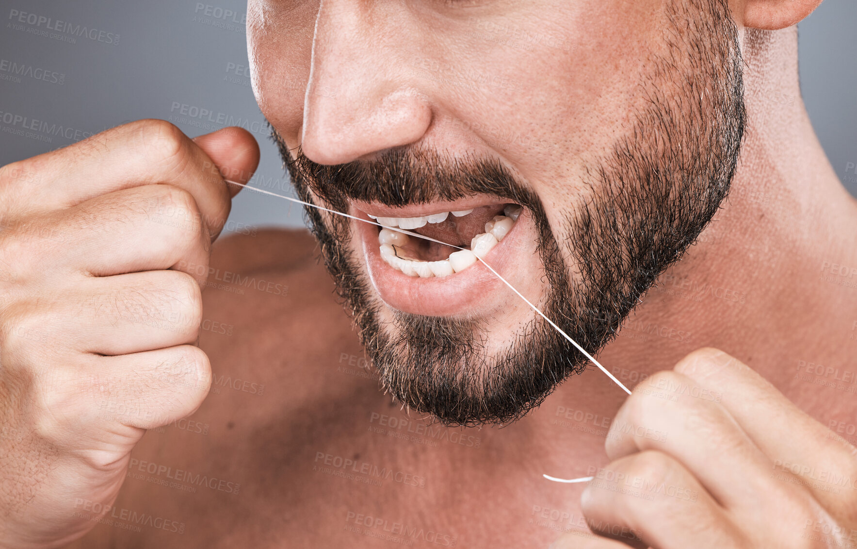 Buy stock photo Mouth floss, tooth and man in studio for beauty, healthy body care and hygiene on background. Closeup of male, teeth flossing and cleaning face for facial wellness, fresh breath and dental cosmetics