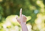 Hand, nature and sustainability with a woman touching a green background for eco friendly conservation. Finger, spring and growth with a female outdoor in a natural environment to touch foliage