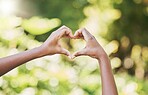 Hands, heart and sign for agriculture love, nature or eco friendly environment in the outdoors. Hand of person showing hearty shape emoji, symbol or icon for natural sustainability, growth or ecology